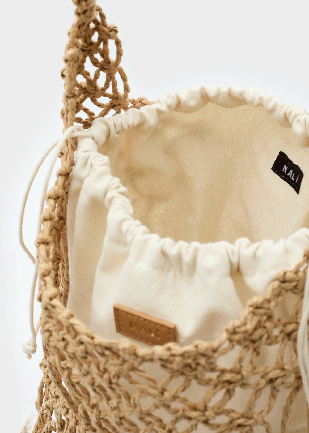 Nalí SYLVIA BUCKET BAG IN RAFFIA + COLORS