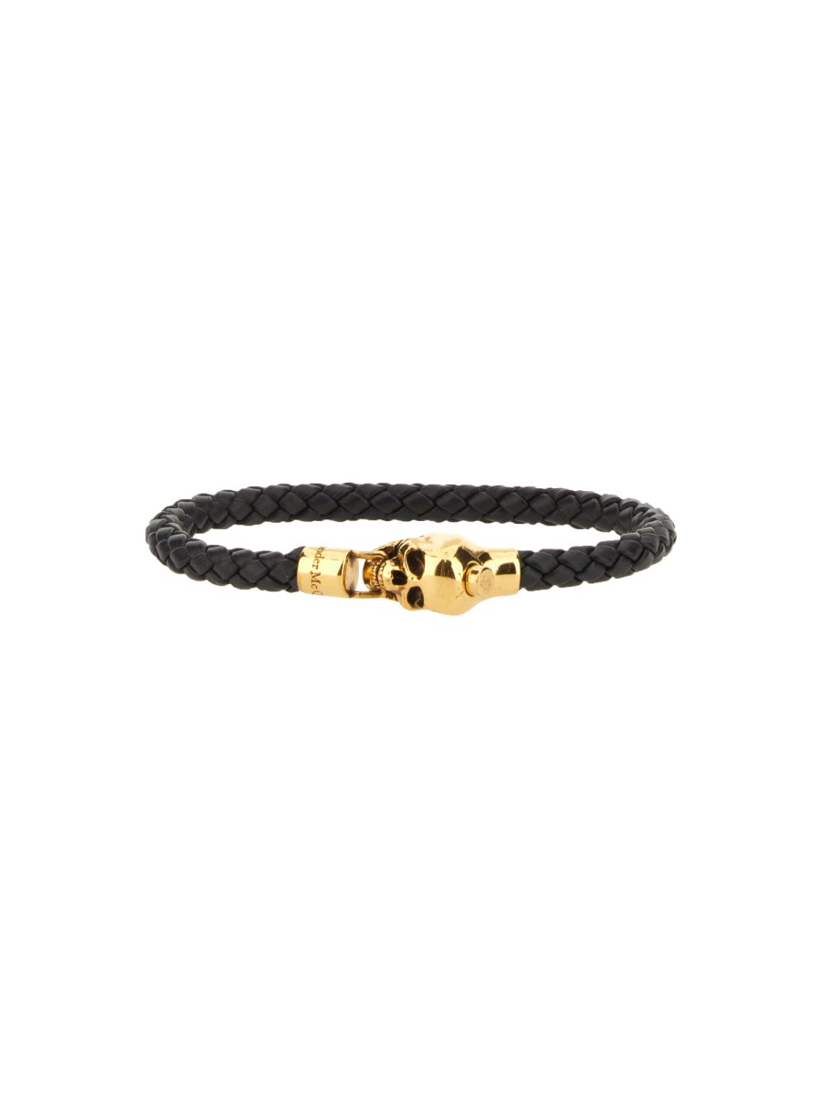 ALEXANDER McQUEEN BRACCIALE IN PELLE INTRECCIATA CON CHARM SKULL
