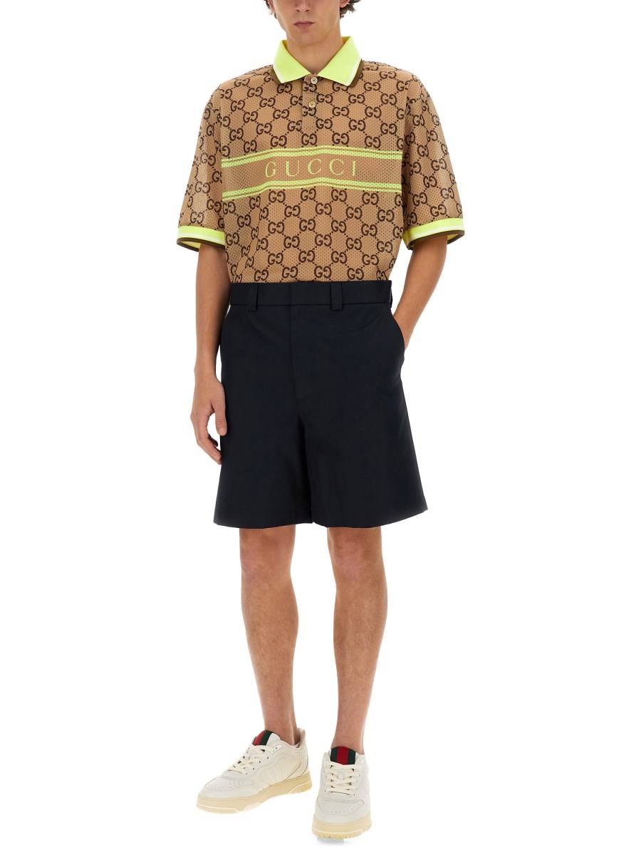 GUCCI POLO CON STAMPA GG IN RETE DI POLIESTERE