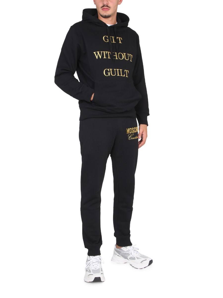 MOSCHINO FELPA "GUILT WITHOUT GUILT" IN COTONE