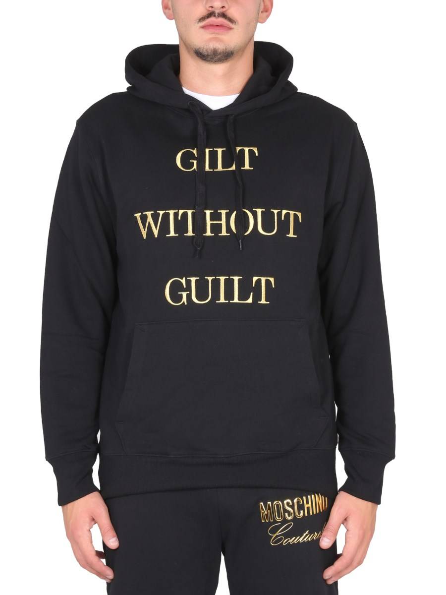 MOSCHINO FELPA "GUILT WITHOUT GUILT" IN COTONE