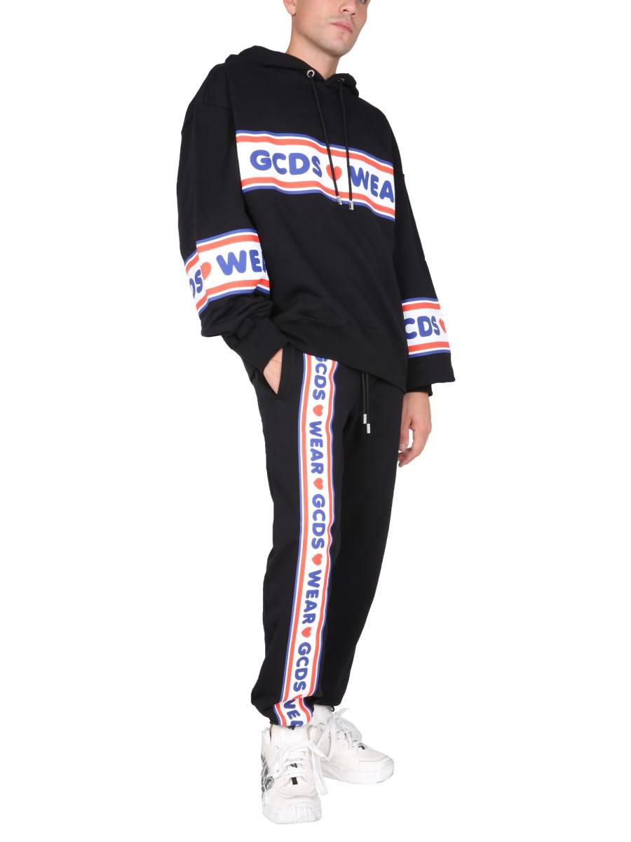 GCDS PANTALONE JOGGING IN COTONE CON BANDA LOGO CUTE TAPE