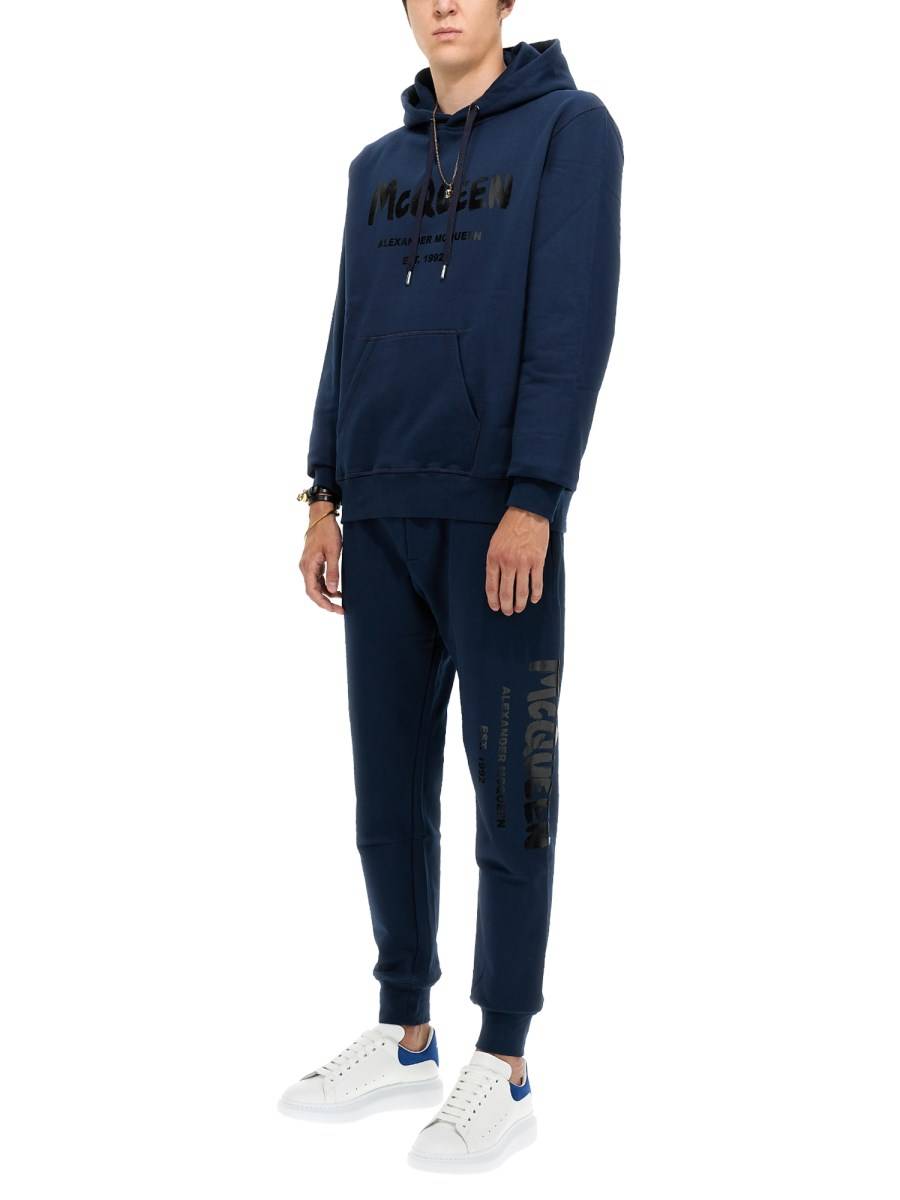 ALEXANDER McQUEEN PANTALONE JOGGING IN COTONE CON LOGO GRAFFITI