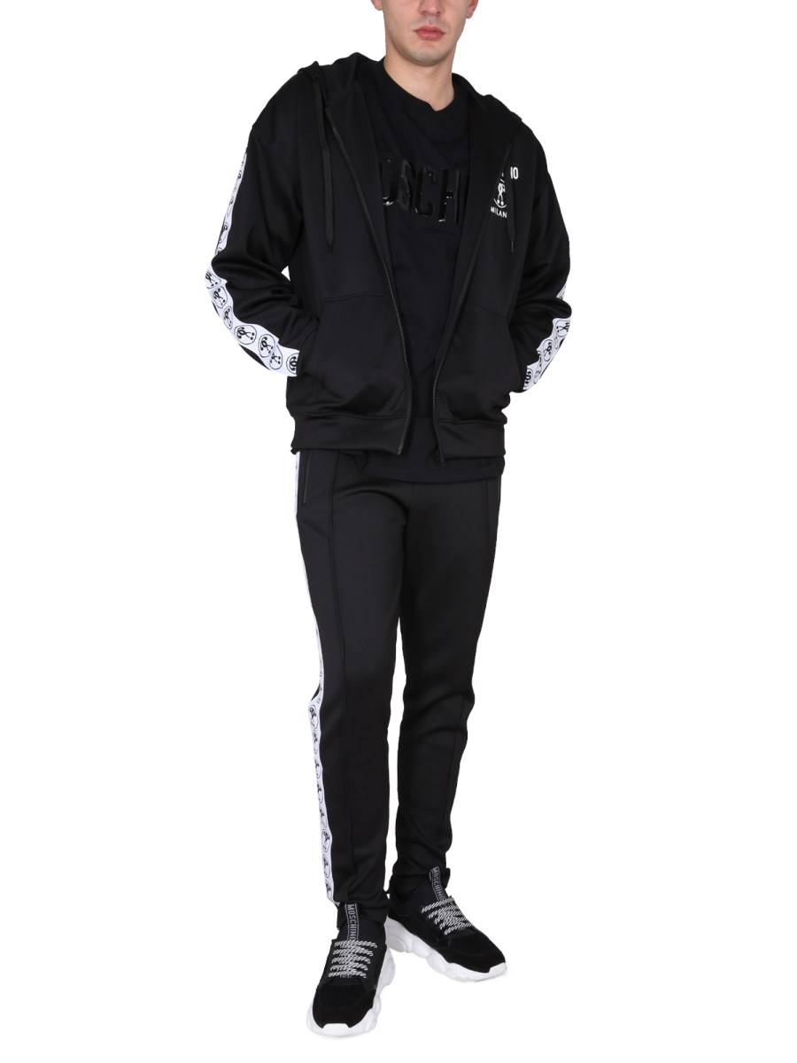 MOSCHINO PANTALONE JOGGING IN FELPA TECNICA CON LOGO JACQUARD