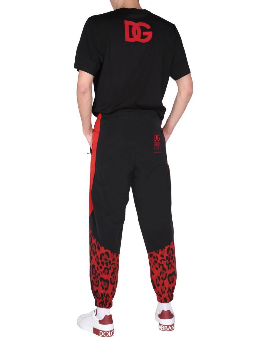 DOLCE & GABBANA PANTALONE JOGGING IN NYLON CON STAMPA ANIMALIER