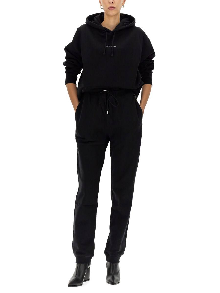 1017 ALYX 9SM PANTALONE JOGGING VISUAL IN FELPA DI COTONE CON STAMPA LOGO