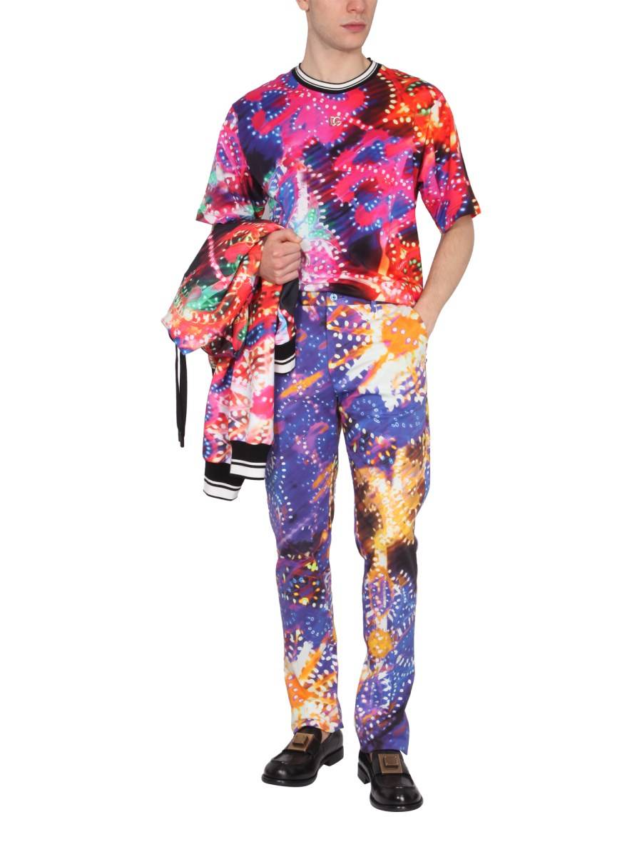 DOLCE & GABBANA PANTALONE SLIM FIT IN COTONE CON STAMPA LUMINARIE