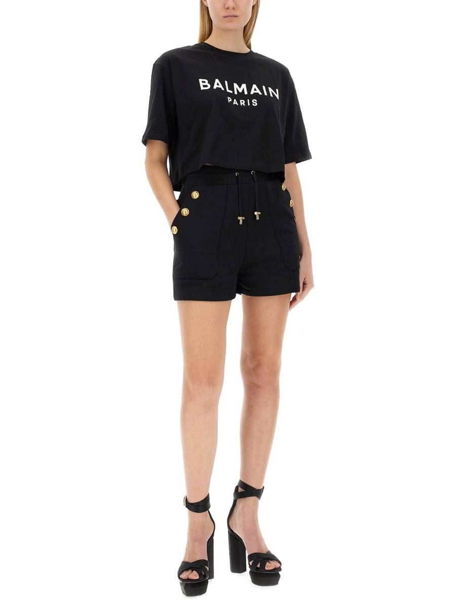 BALMAIN T-SHIRT CROPPED IN JERSEY DI COTONE CON STAMPA LOGO
