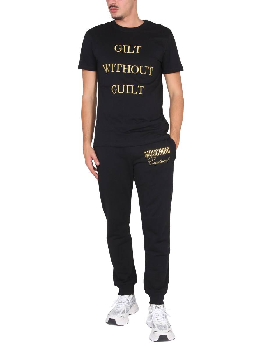 MOSCHINO T-SHIRT "GUILT WITHOUT GUILT" IN JERSEY DI COTONE