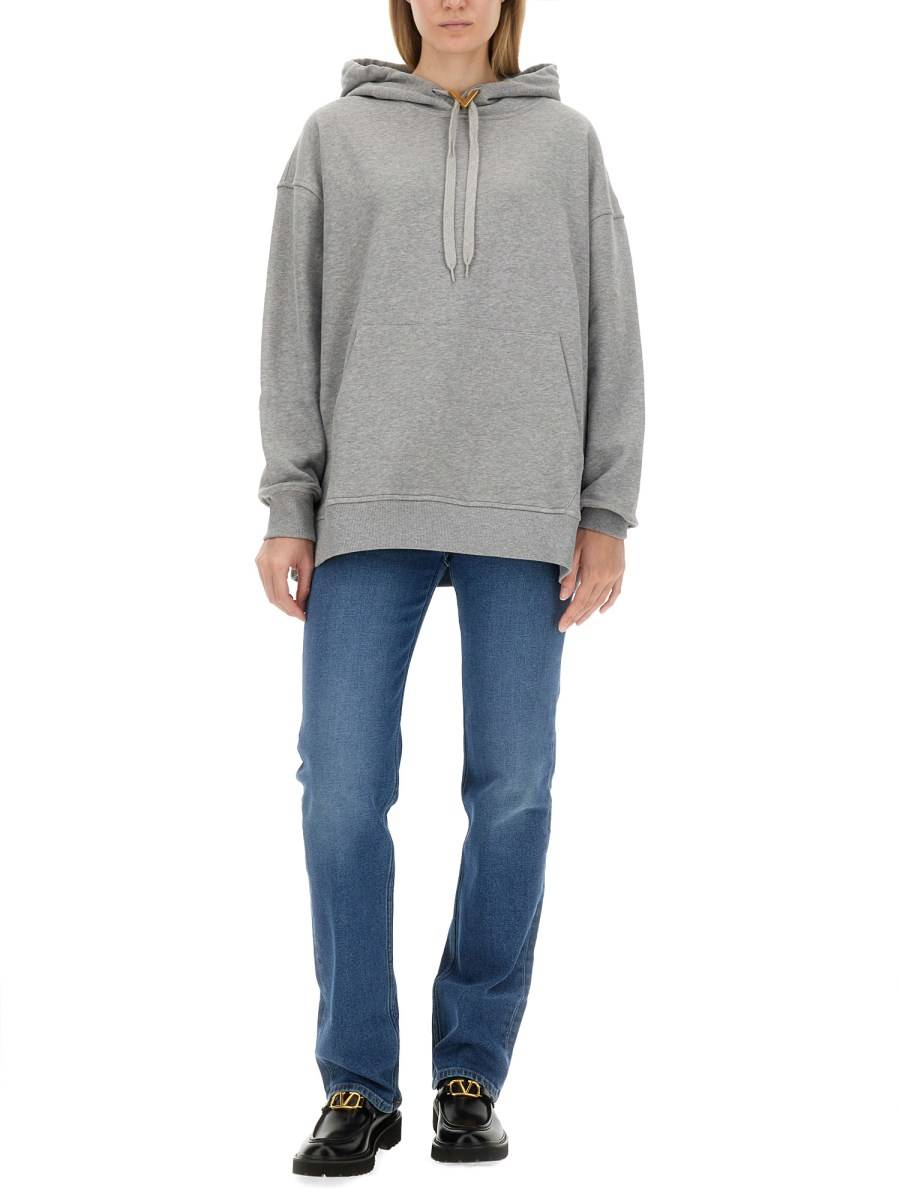 VALENTINO PANTALONE IN DENIM CON V DETAILS