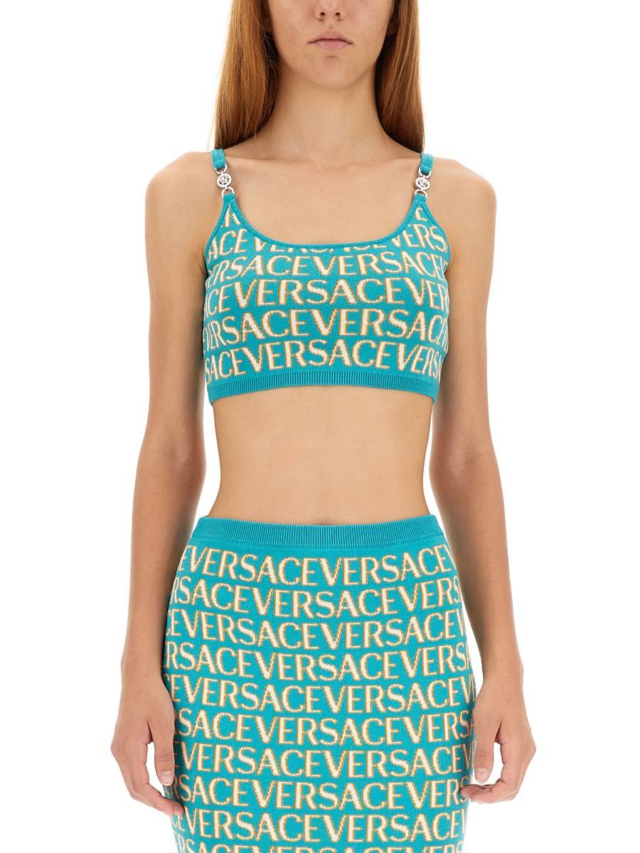 VERSACE TOP CORTO IN MAGLIA CON LOGO ALLOVER