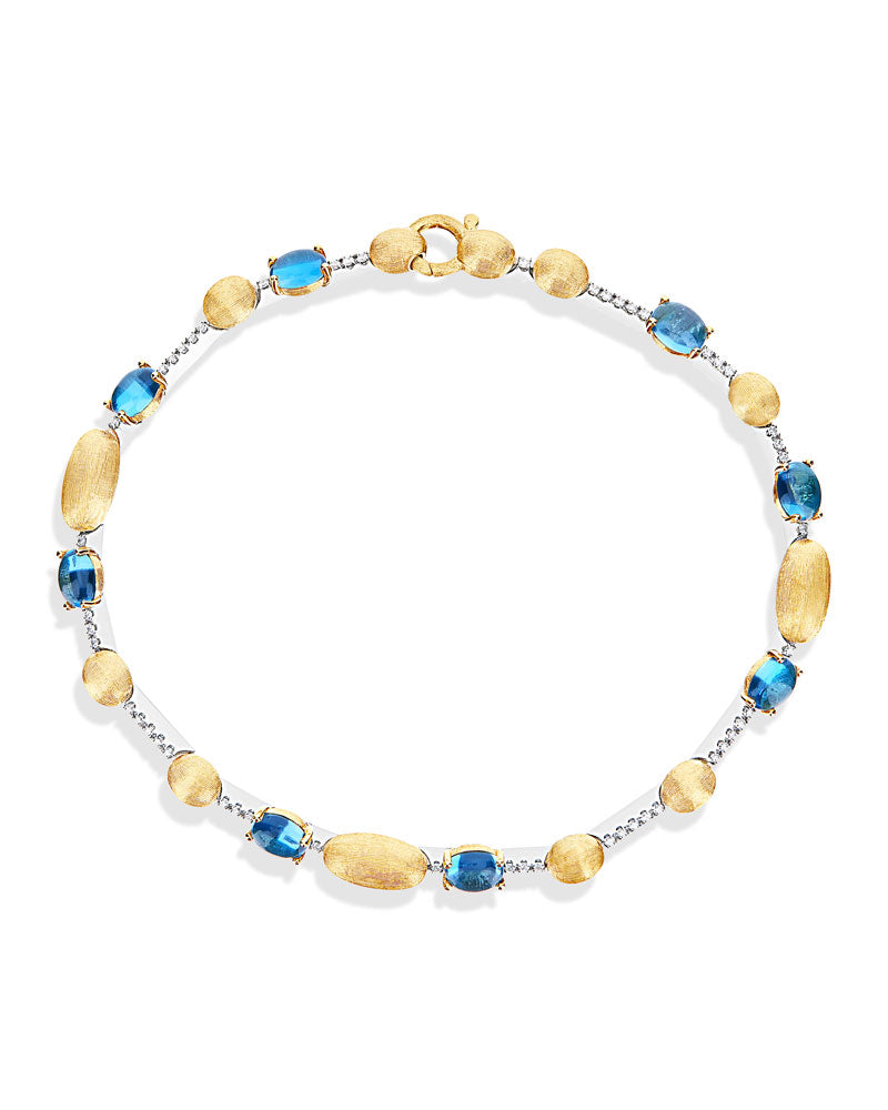 Nanis Bracciale tennis "DANCING AZURE" in oro, diamanti e topazio London blu – Nanis Italian Jewels
