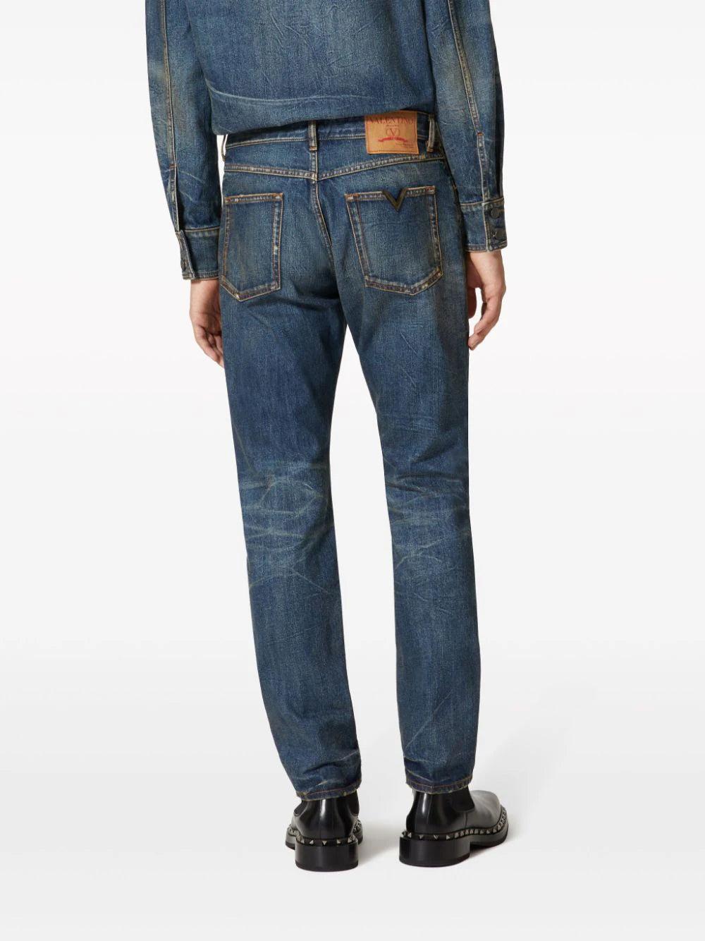 Valentino Garavani Denim Trousers With Metallic V Detail