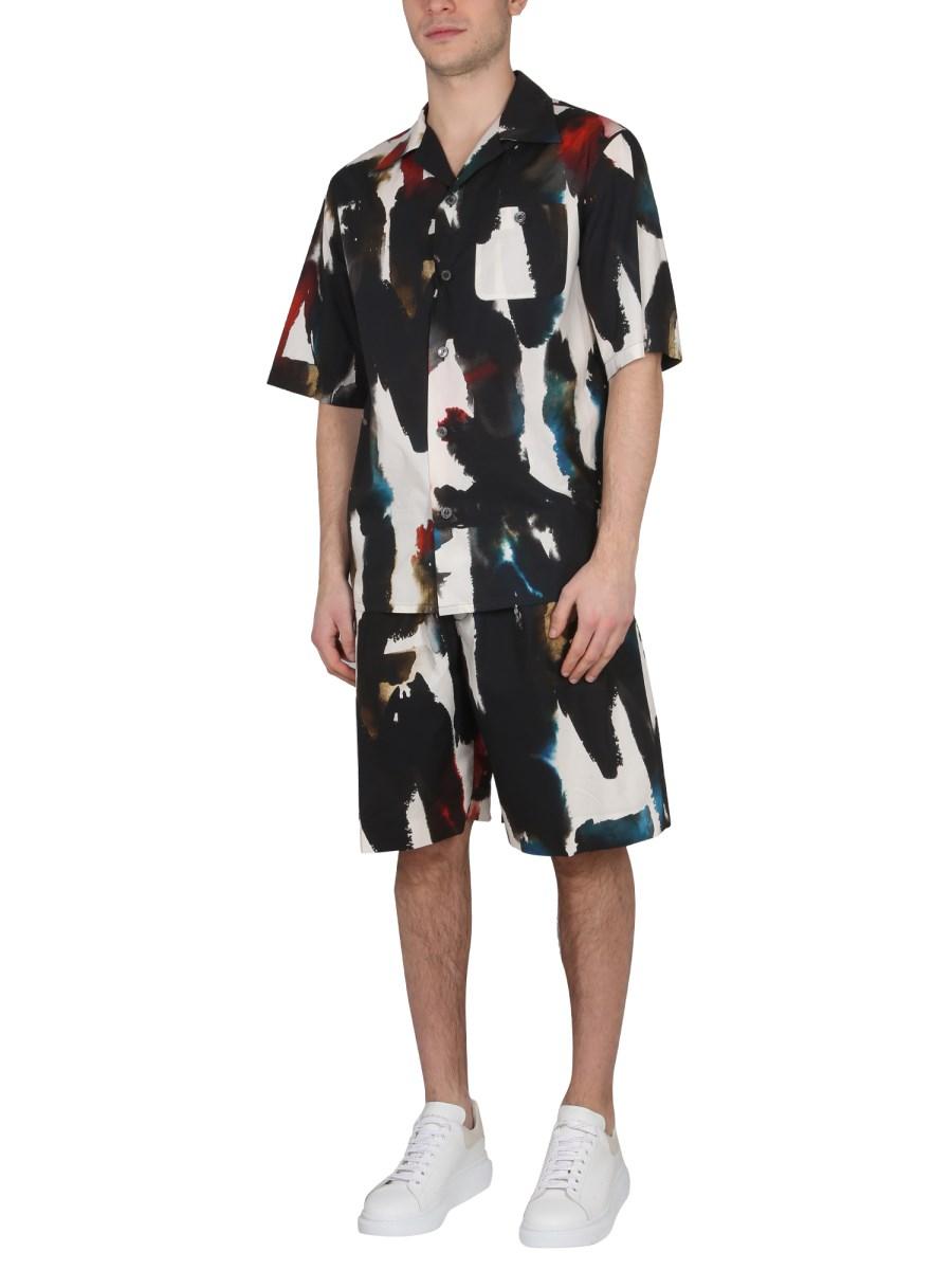 ALEXANDER McQUEEN BERMUDA CON STAMPA LOGO GRAFFITI ACQUARELLO IN COTONE