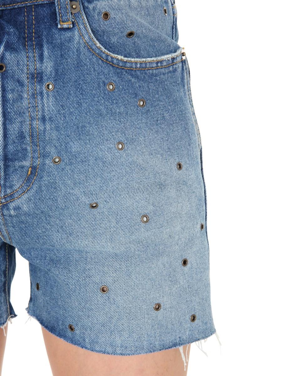 SAINT LAURENT BERMUDA IN DENIM DI COTONE CON OCCHIELLI METALLICI