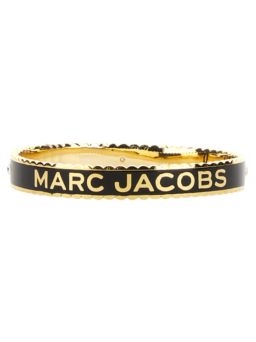 MARC JACOBS BRACCIALE RIGIDO A MEDAGLIONE PLACCATO CON BORDO SMERLATO