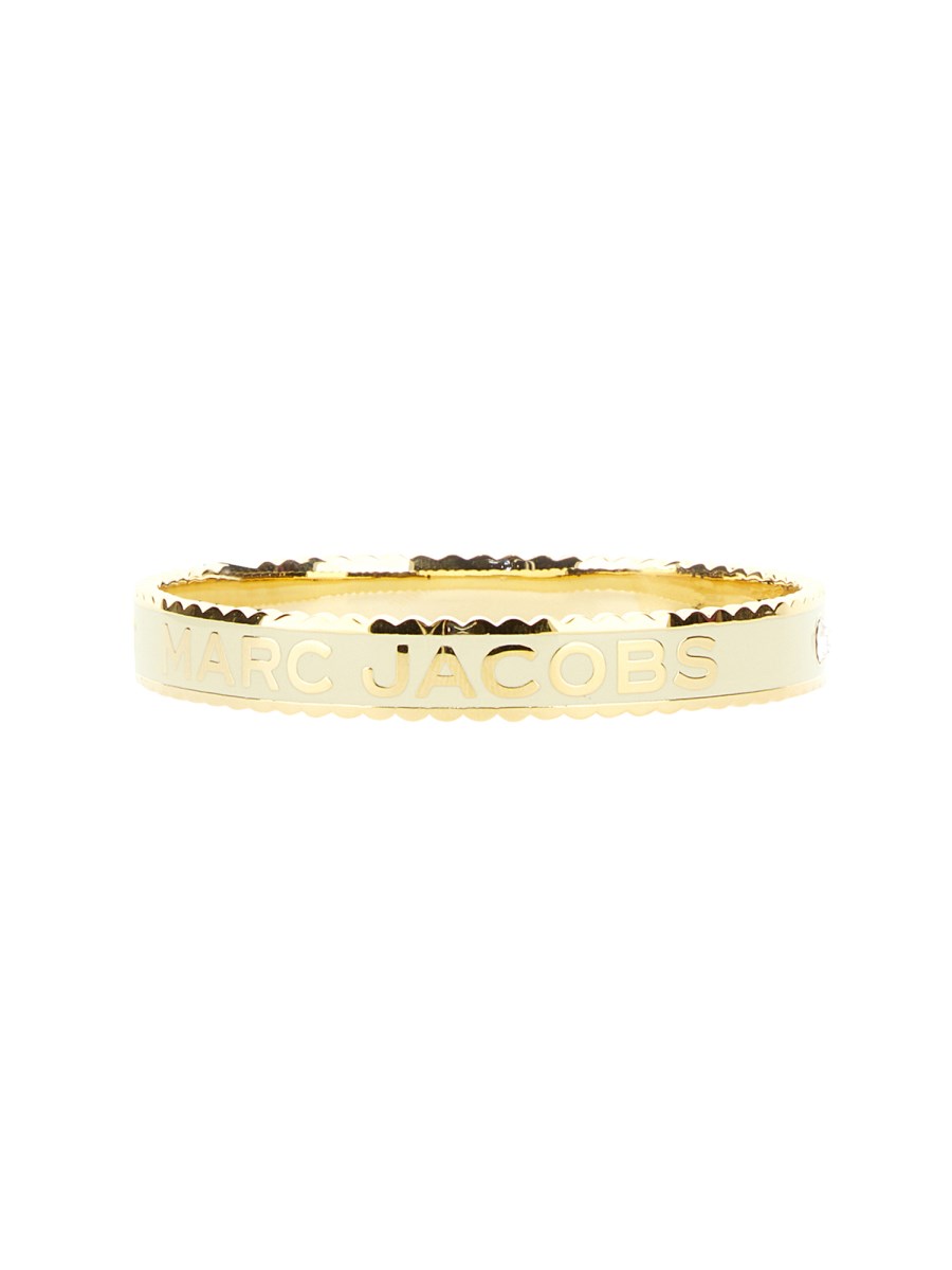 MARC JACOBS BRACCIALE RIGIDO A MEDAGLIONE PLACCATO CON BORDO SMERLATO