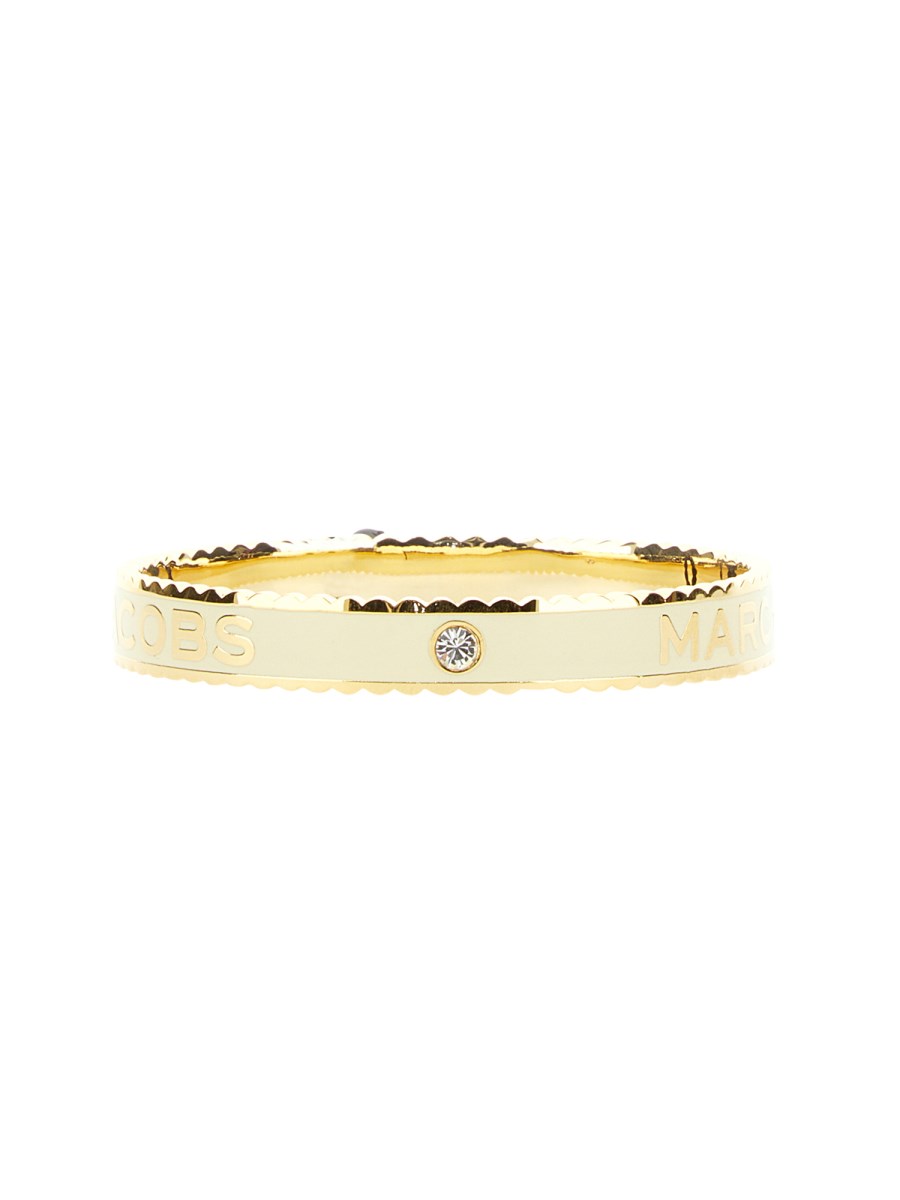 MARC JACOBS BRACCIALE RIGIDO A MEDAGLIONE PLACCATO CON BORDO SMERLATO
