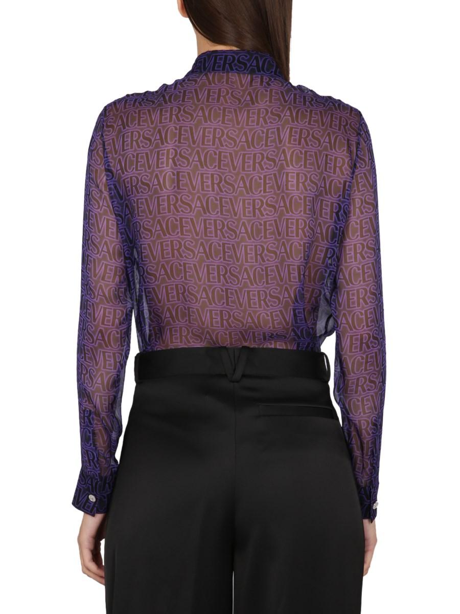 VERSACE CAMICIA IN SETA TRASPARENTE CON LOGO ALL OVER