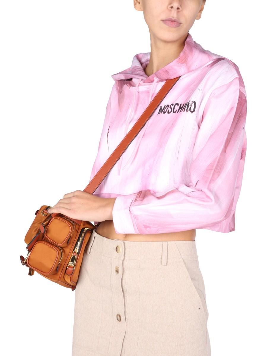 MOSCHINO FELPA CROPPED "ART THEME" IN JERSEY DI COTONE CON STAMPA LOGO GOMMATA