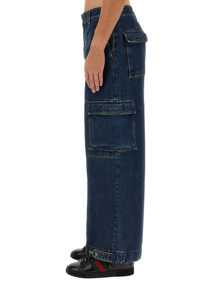 GUCCI PANTALONE IN DENIM CON ETICHETTA GUCCI