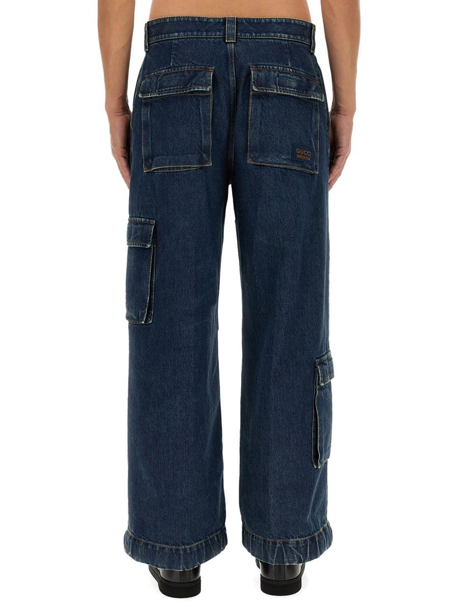 GUCCI PANTALONE IN DENIM CON ETICHETTA GUCCI