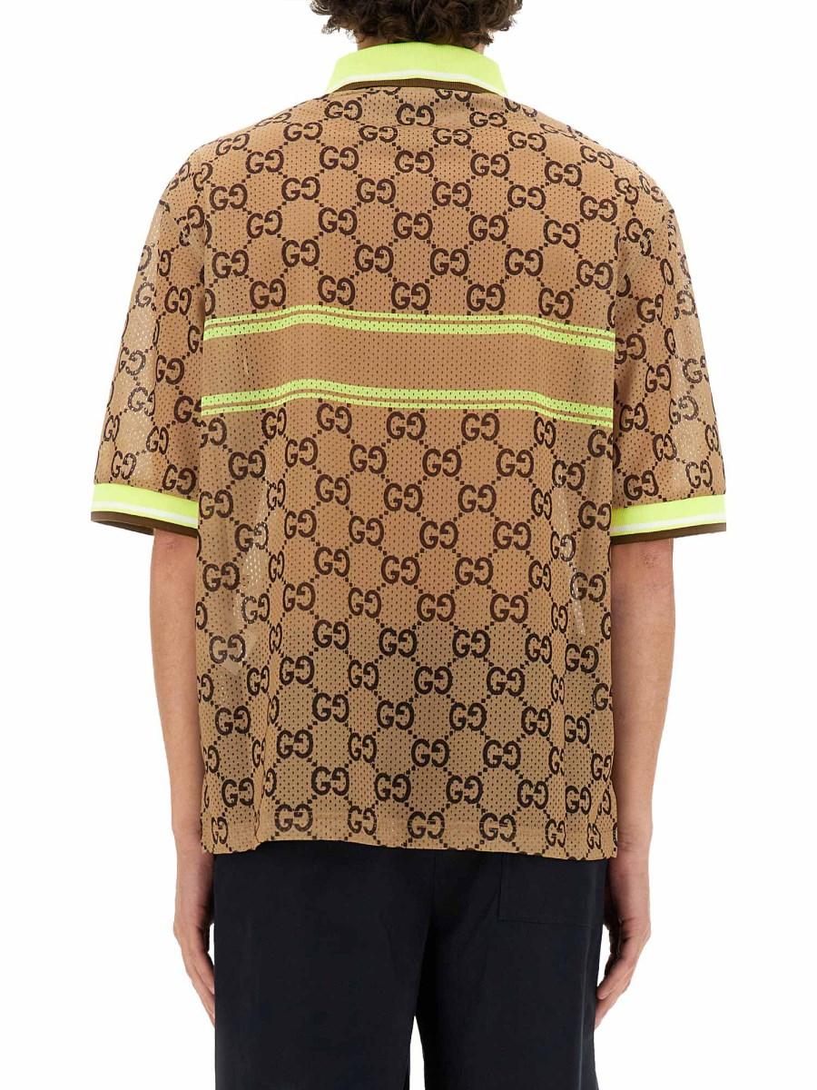 GUCCI POLO CON STAMPA GG IN RETE DI POLIESTERE