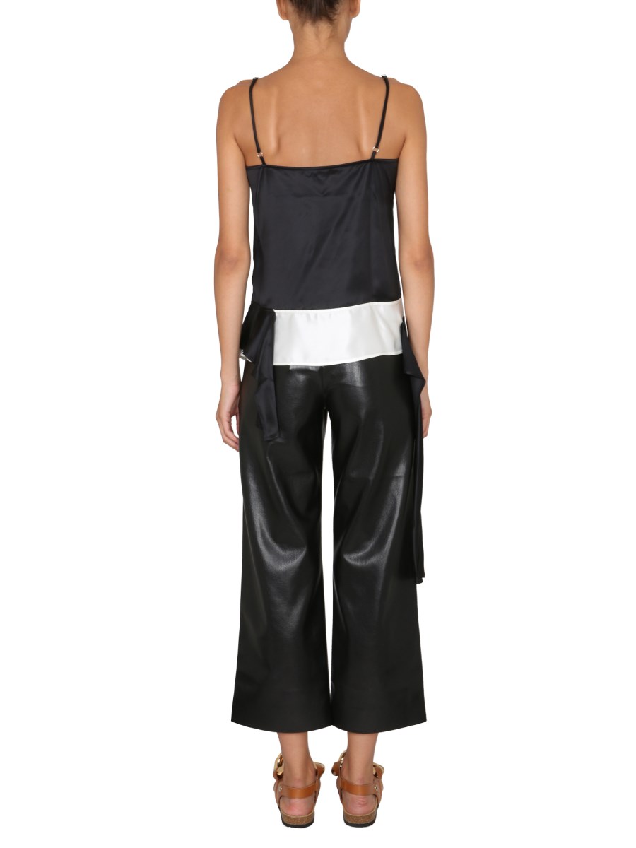 JW ANDERSON TOP IN ACETATO CON SCOLLO A CUORE