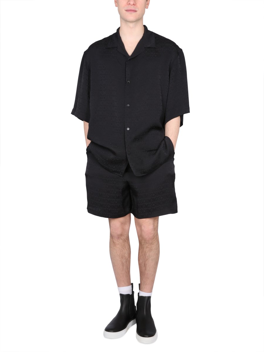 MOSCHINO SHORTS CON LOGO IN SATIN DI VISCOSA