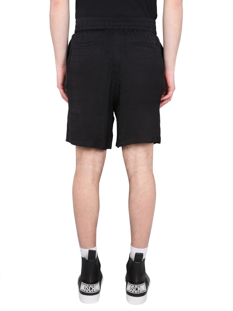 MOSCHINO SHORTS CON LOGO IN SATIN DI VISCOSA