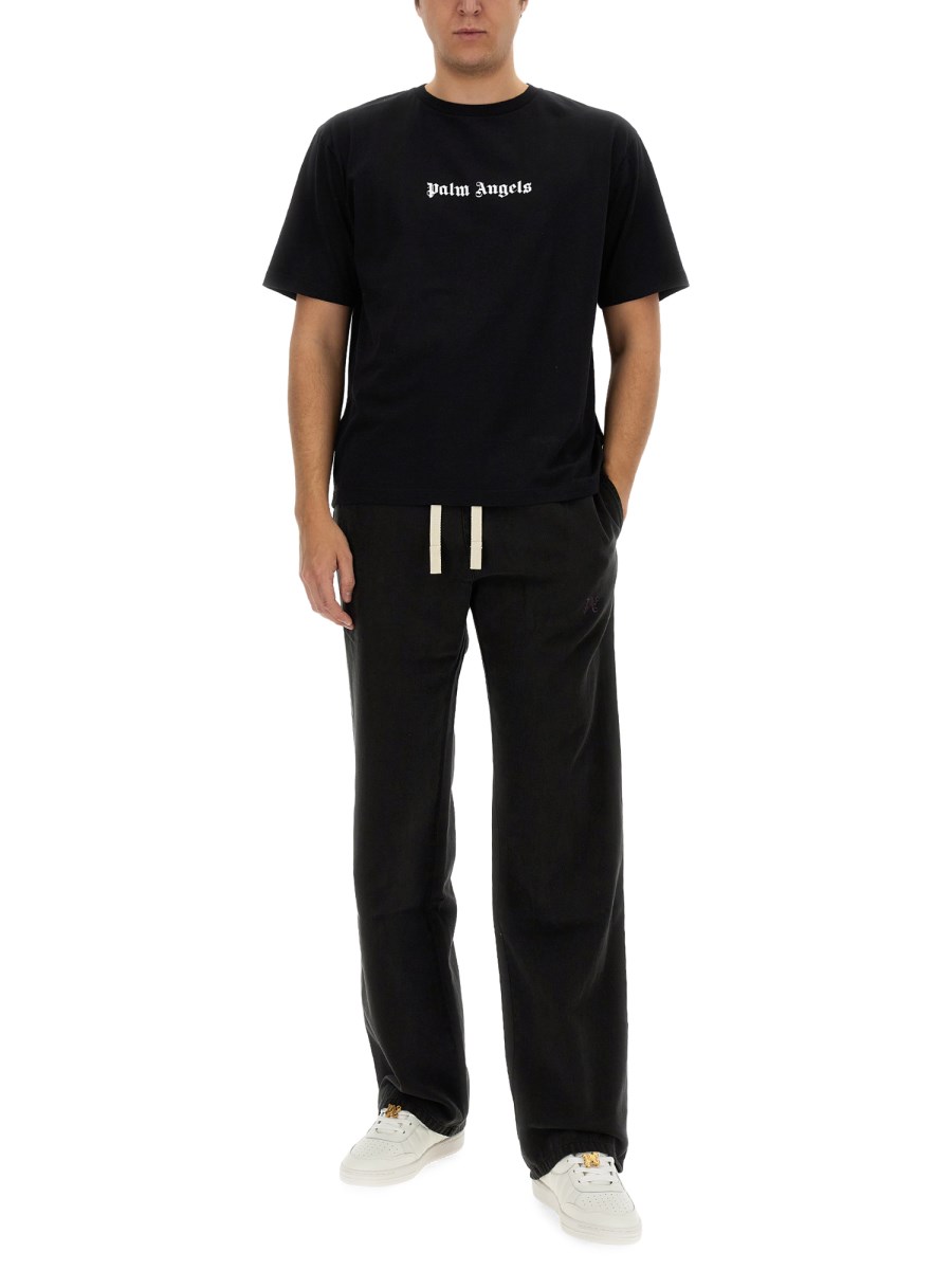 PALM ANGELS PANTALONE IN LYOCEL CON LOGO