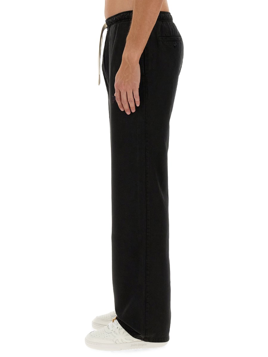 PALM ANGELS PANTALONE IN LYOCEL CON LOGO