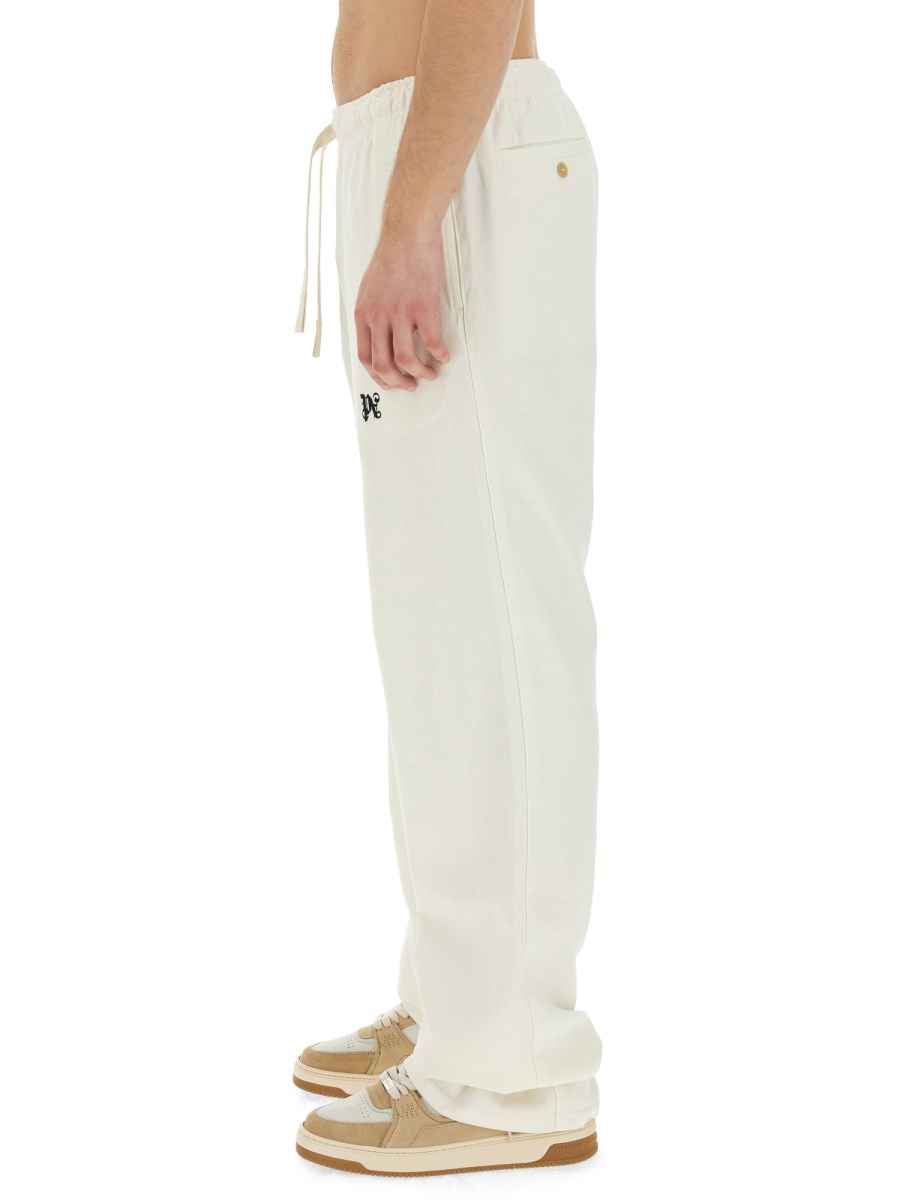 PALM ANGELS PANTALONE IN LYOCEL CON LOGO