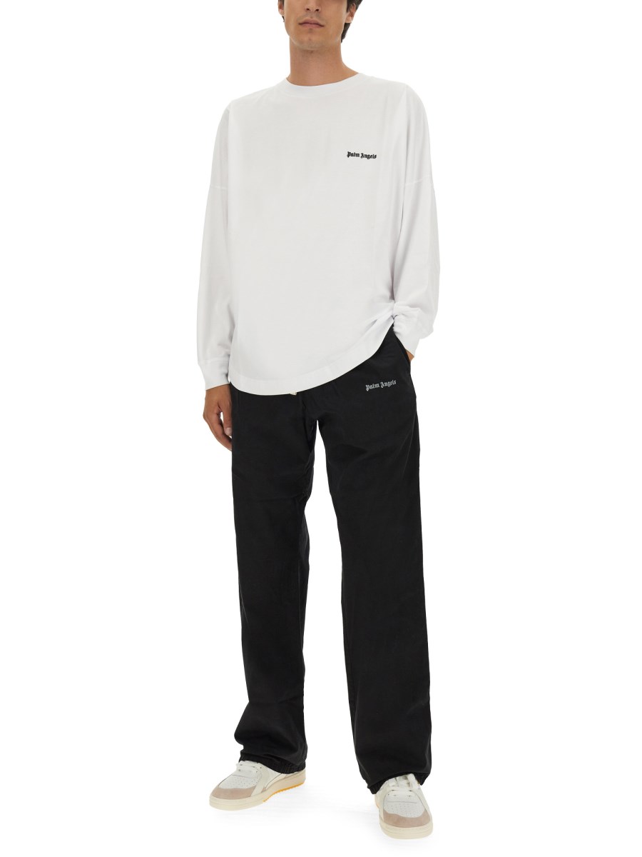 PALM ANGELS PANTALONE MONOGRAM IN FELPA DI COTONE