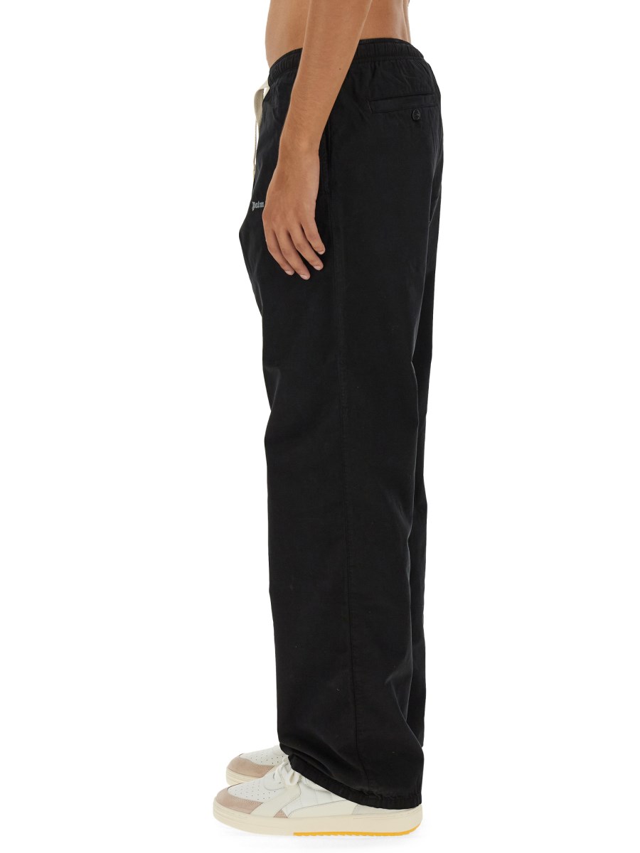 PALM ANGELS PANTALONE MONOGRAM IN FELPA DI COTONE
