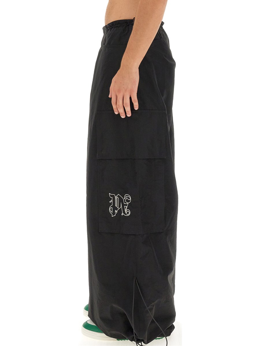PALM ANGELS PANTALONI PARACHUTE CON MONOGRAM