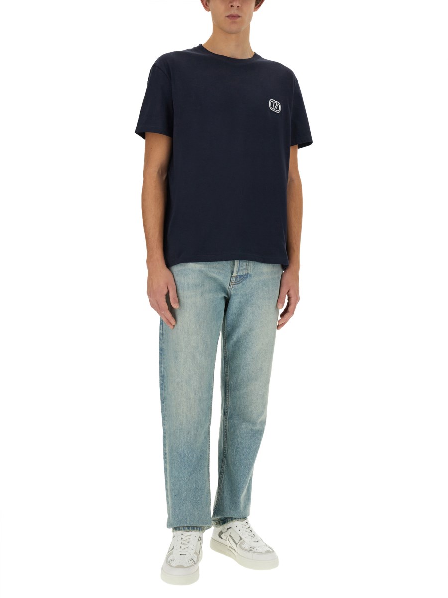 VALENTINO PANTALONE IN DENIM CON" VLOGO SIGNATURE" IMPRESSO