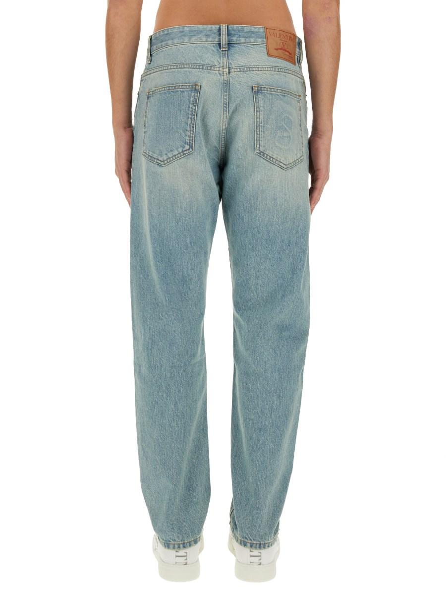 VALENTINO PANTALONE IN DENIM CON" VLOGO SIGNATURE" IMPRESSO