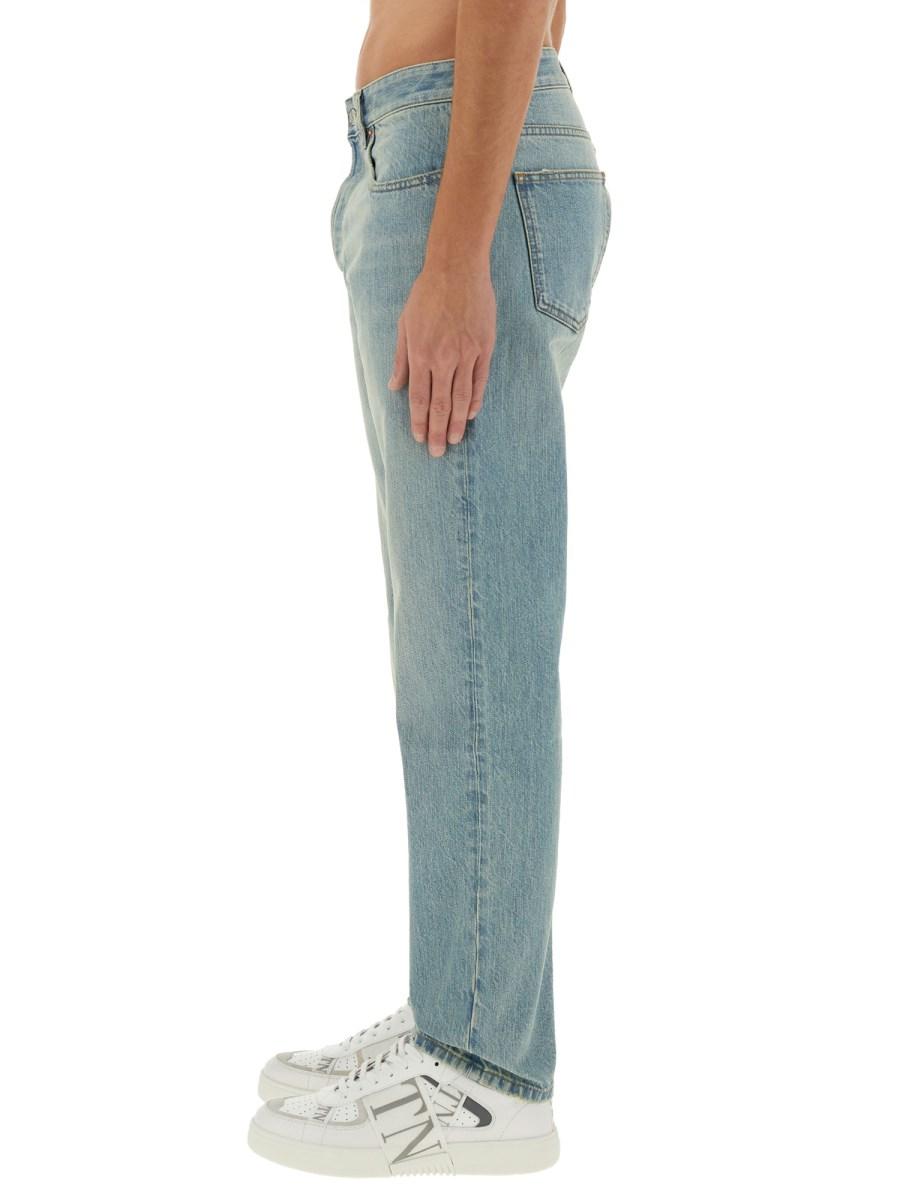 VALENTINO PANTALONE IN DENIM CON" VLOGO SIGNATURE" IMPRESSO