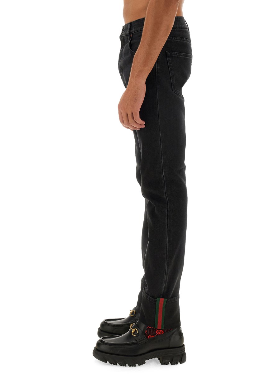 GUCCI PANTALONE IN DENIM DI COTONE CON DETTAGLI WEB