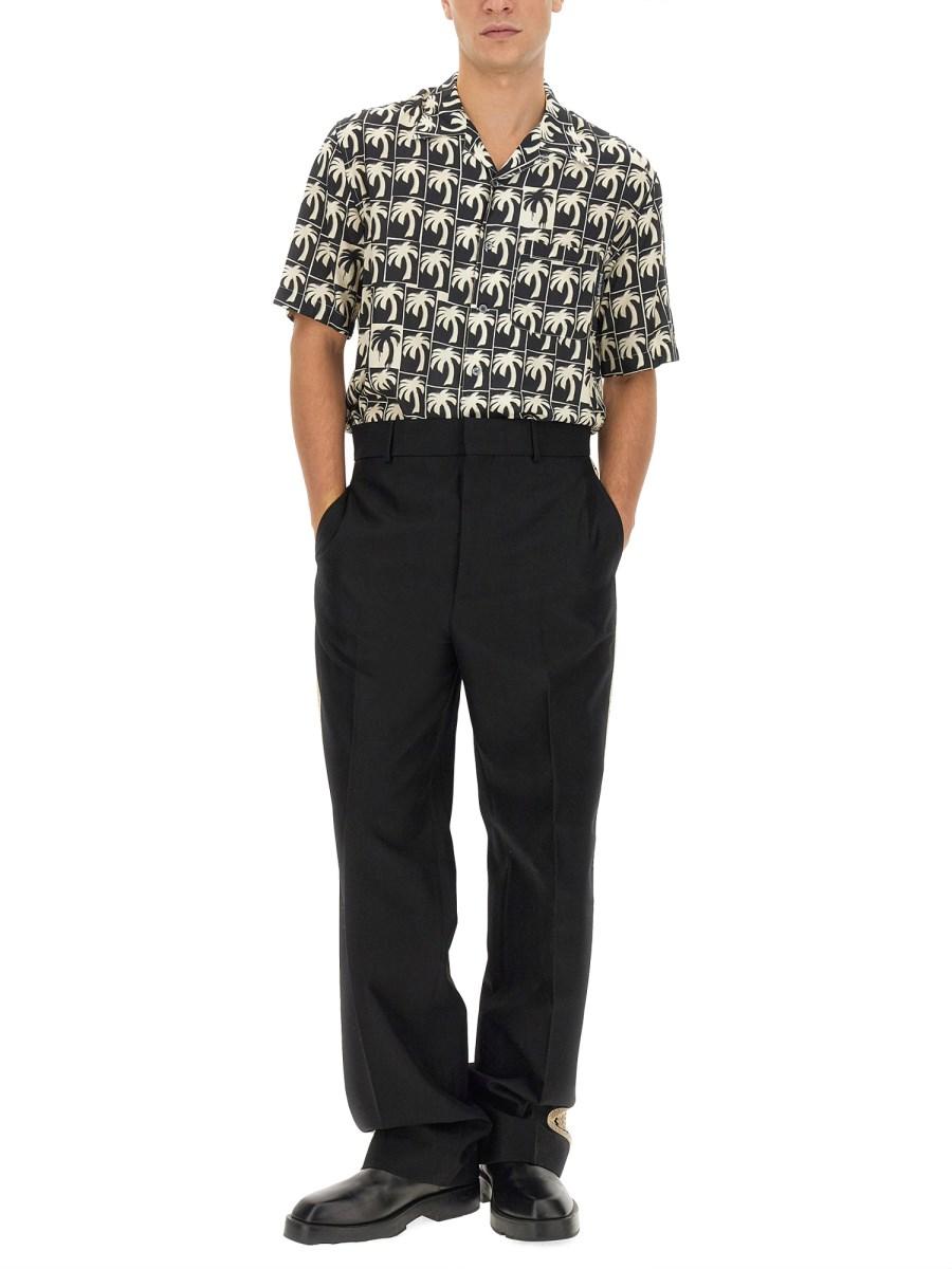 PALM ANGELS PANTALONE IN TESSUTO TECNICO CON BANDA LOGO