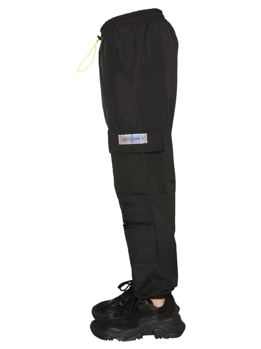 DISCLAIMER PANTALONE IN TESSUTO TECNICO CON COULISSE E TASCHE CARGO