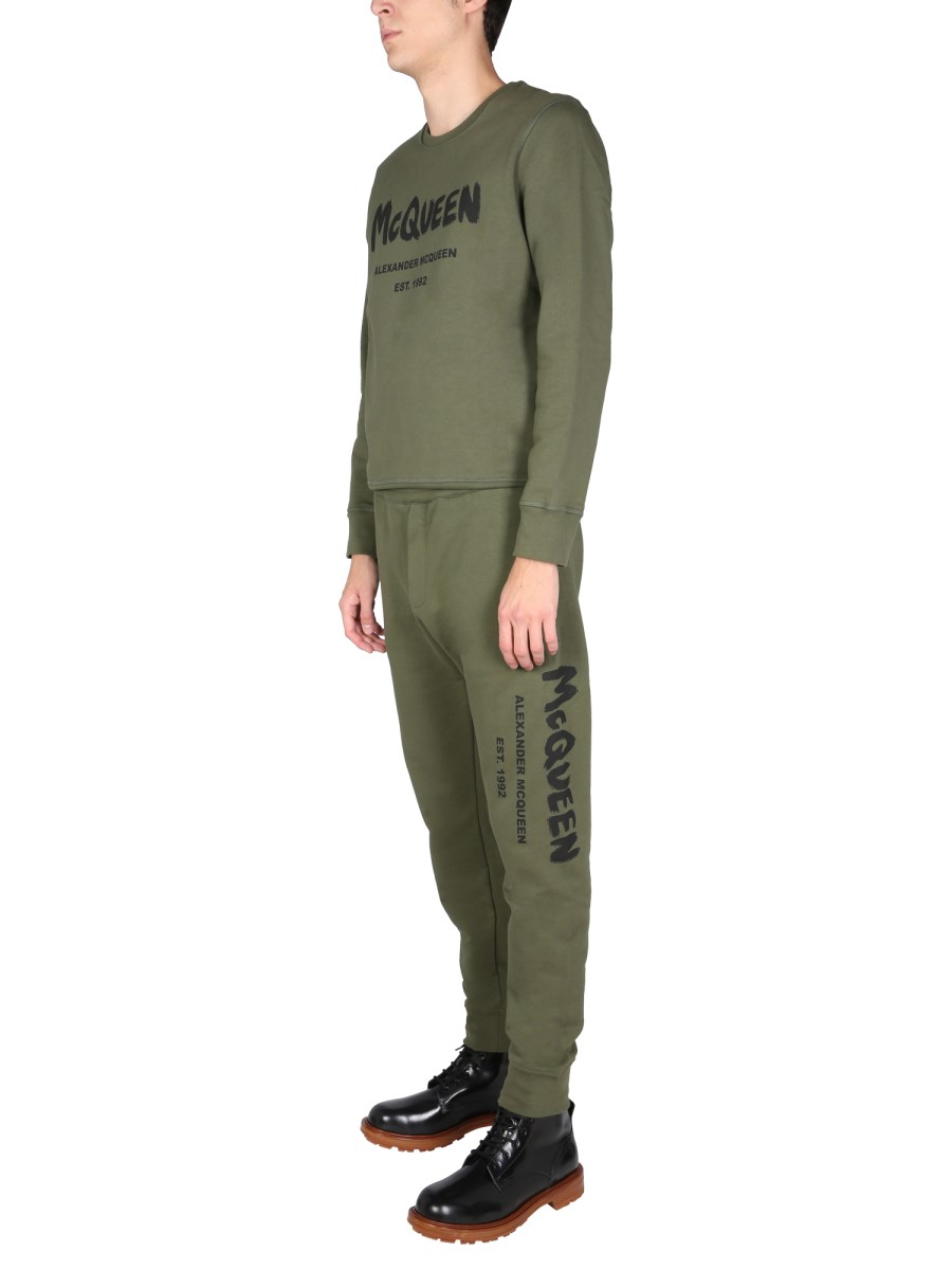 ALEXANDER McQUEEN PANTALONE JOGGING CON LOGO GRAFFITI