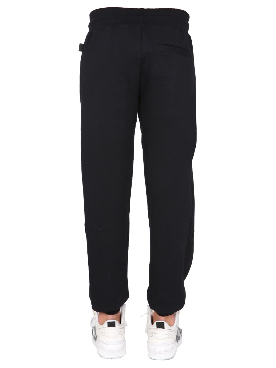 GCDS PANTALONE JOGGING IN COTONE CON BANDA LOGO "CUTE TAPE"