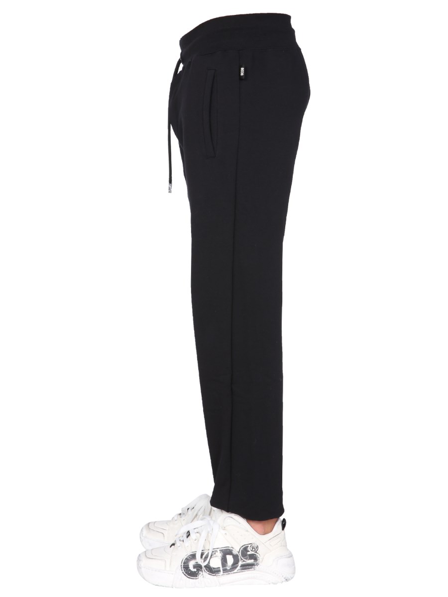 GCDS PANTALONE JOGGING IN COTONE CON BANDA LOGO "CUTE TAPE"