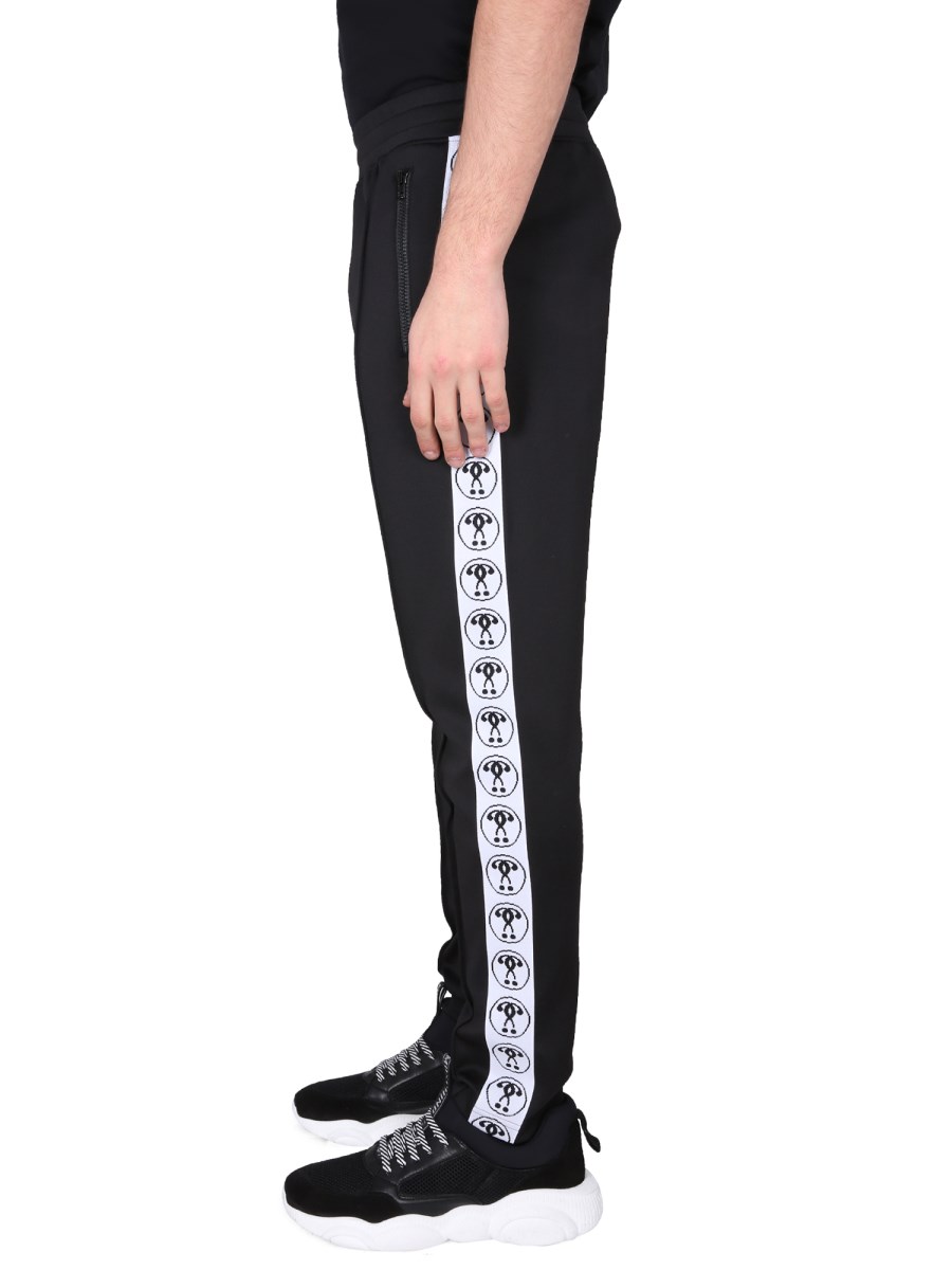MOSCHINO PANTALONE JOGGING IN FELPA TECNICA CON LOGO JACQUARD