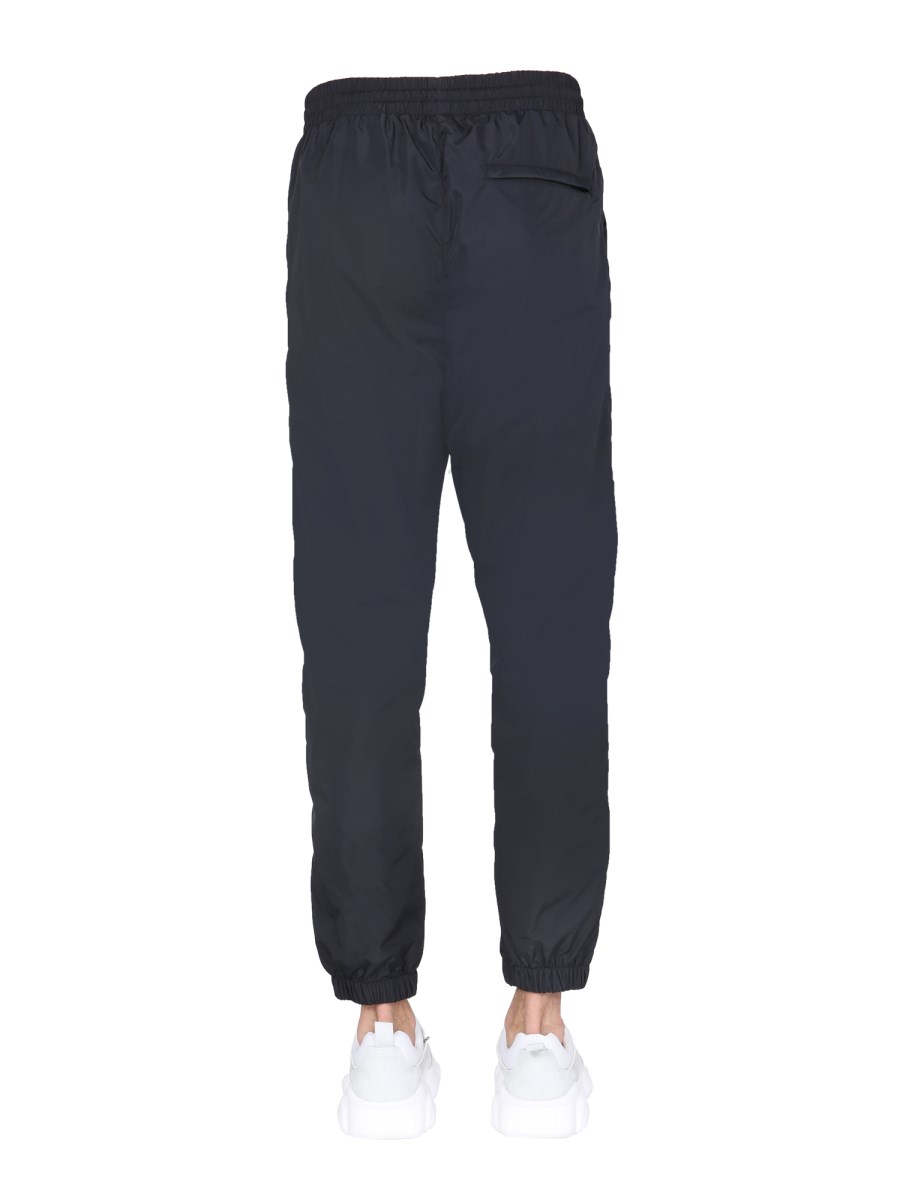 MOSCHINO PANTALONE JOGGING IN NYLON CON GRAFICA EFFETTO GLITCH