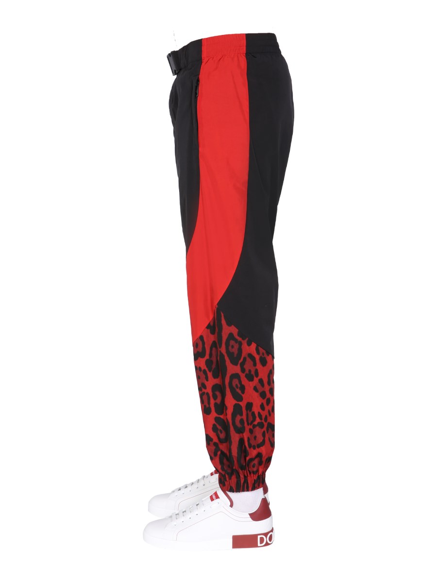 DOLCE & GABBANA PANTALONE JOGGING IN NYLON CON STAMPA ANIMALIER