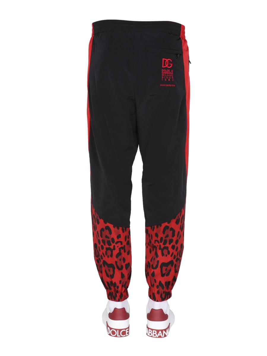 DOLCE & GABBANA PANTALONE JOGGING IN NYLON CON STAMPA ANIMALIER