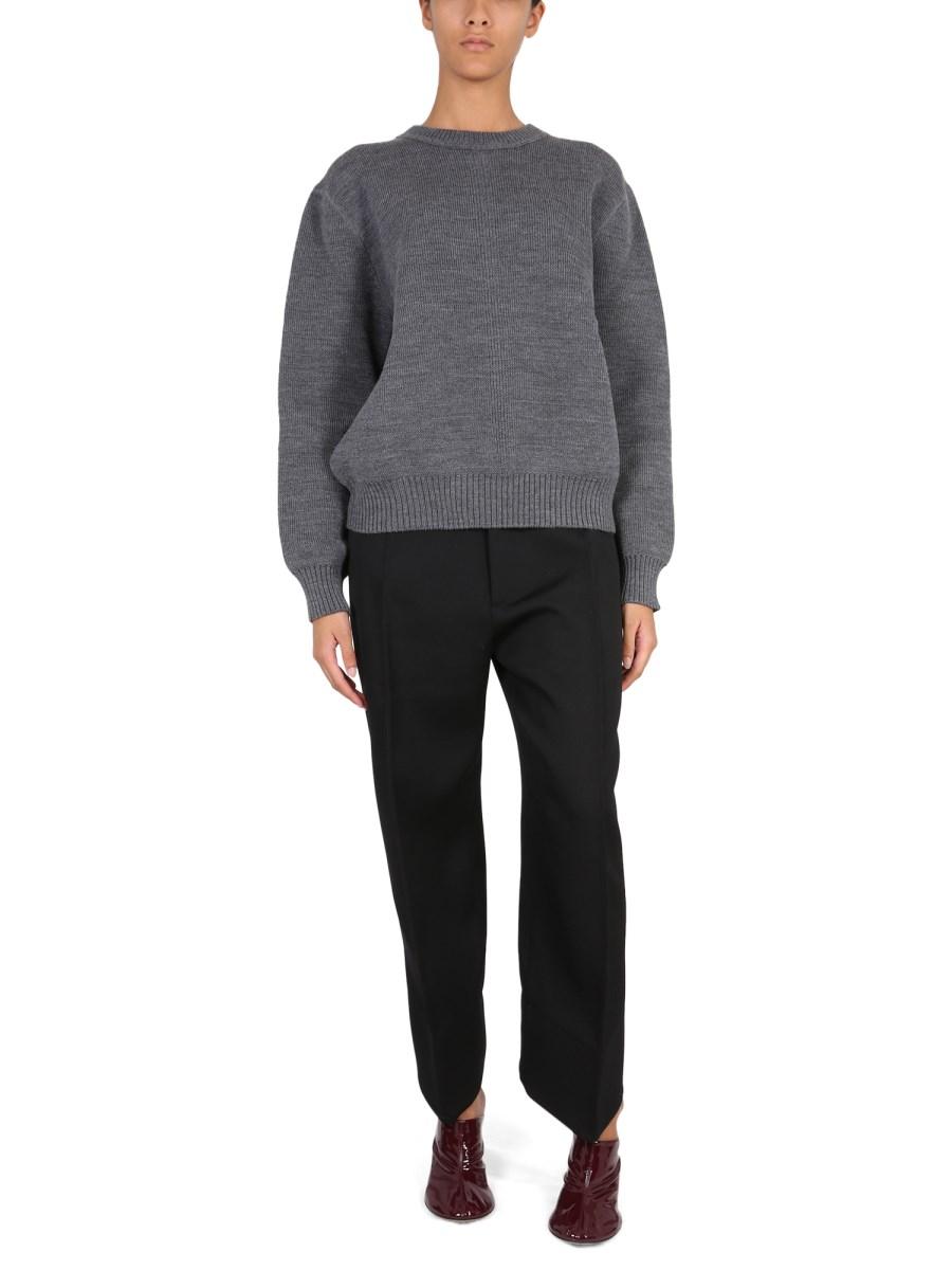 BOTTEGA VENETA PANTALONI IN LANA COMPATTA CON GAMBE CURVE